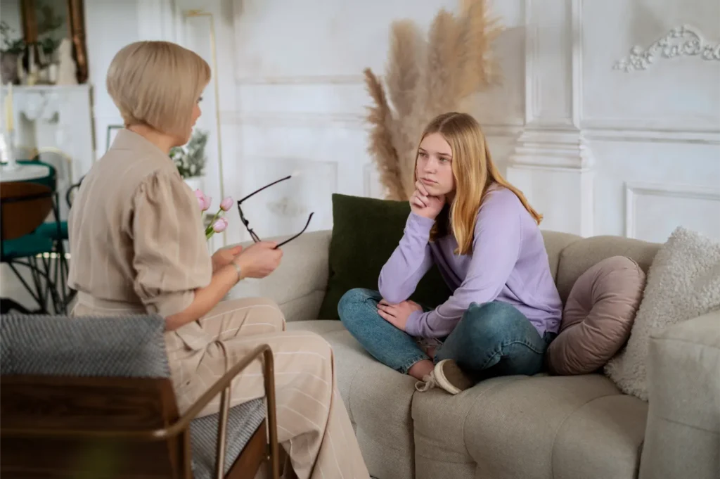 side-view-young-girl-talking-therapist